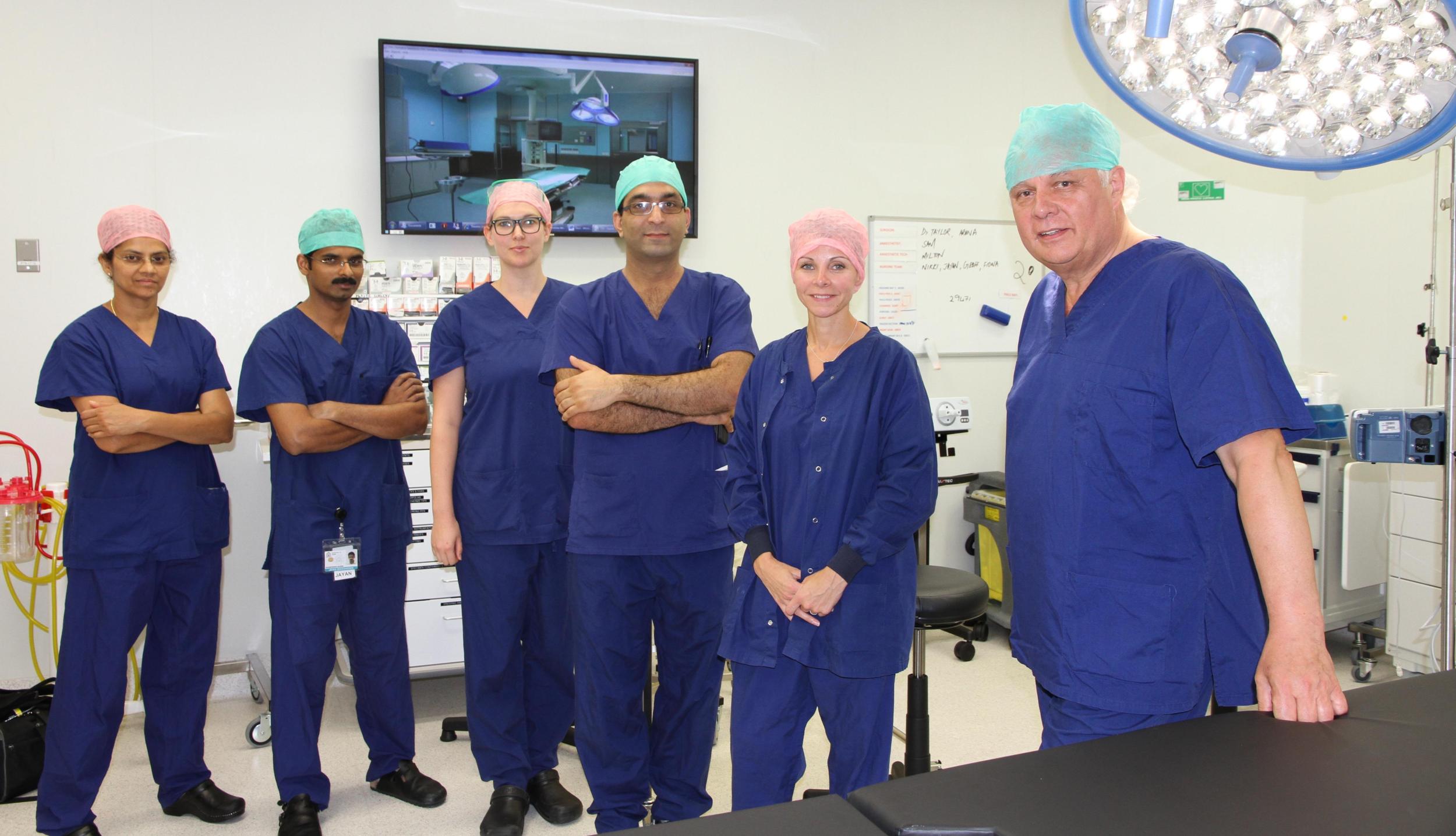 Dr Stewart Flemming and the theatre team hold pre-operative briefings