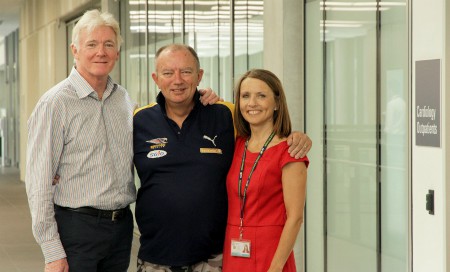 Dr Robert Larbalestier, Rodney Western and Clare Fazackerley standing together in the corridor of Fiona Stanley Hospital