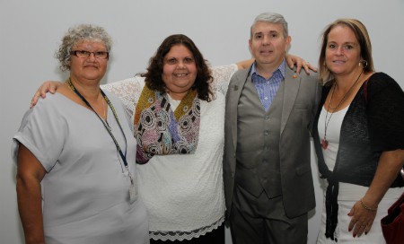 A group photo of three women and one man at the Hospital Hotline launch
