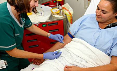 Nurse taking a blood test from patient's forearm